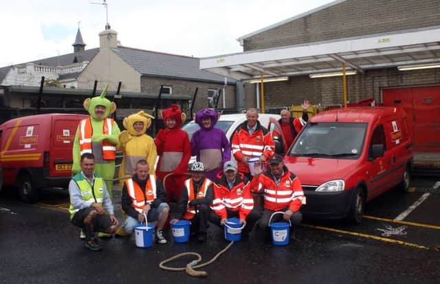 The big pull. Posties in Ballymoney about to start their annual van pull in aid of Cancer Research UK.INBM37-13 283L