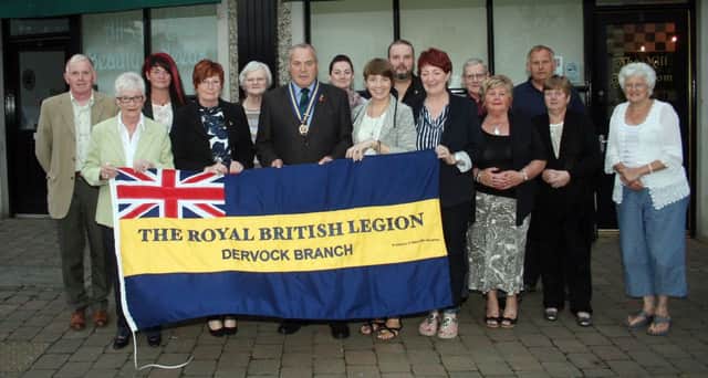 Pictured at the presentation of a new flag for the Dervock branch of the Royal British Legion courtesy of the McLernon family are officers, members and friends.INBM37-13 287L