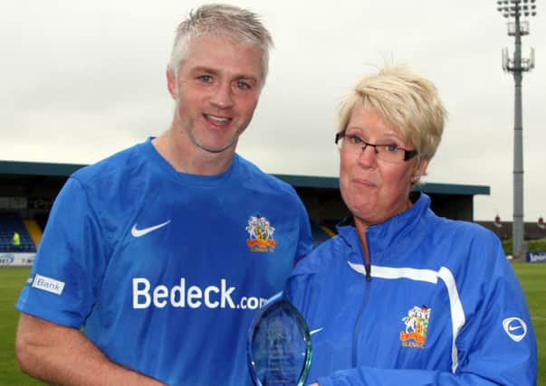 Glenavon director Julie Harvey presents William Murphy with his Player of the Monath award, sponsored by Nigel OHara Diamond Jewellers, Portadown.