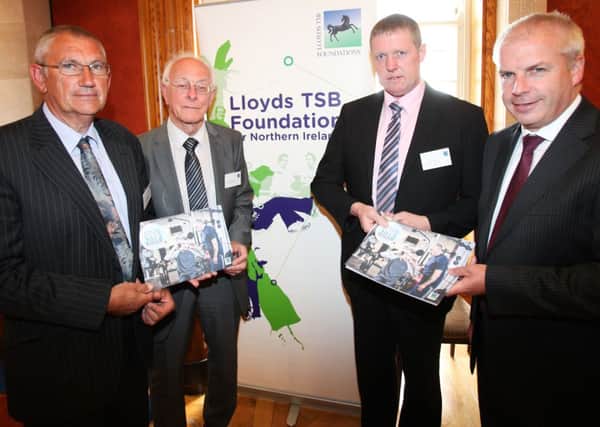 At a reception at Parliament Buildings Paul Snelling and Terry McMullan from the Zomba Action Project and Billy Ellis from Millburn Community Association with Lloyds Banking Group Ambassador for Northern Ireland Jim McCooe.