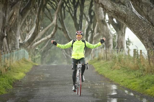 A competitor in the Causeway Sportive makes his way through The Dark Hedges. Picture by Warren McConnaughie.