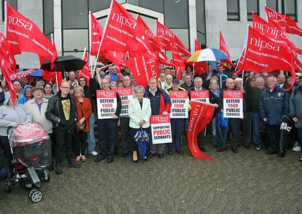PROTEST. . . .Alderman Mary Hamilton standing with workers and council staff supporters at a protest outside the Derry City Council offices on Strand Road