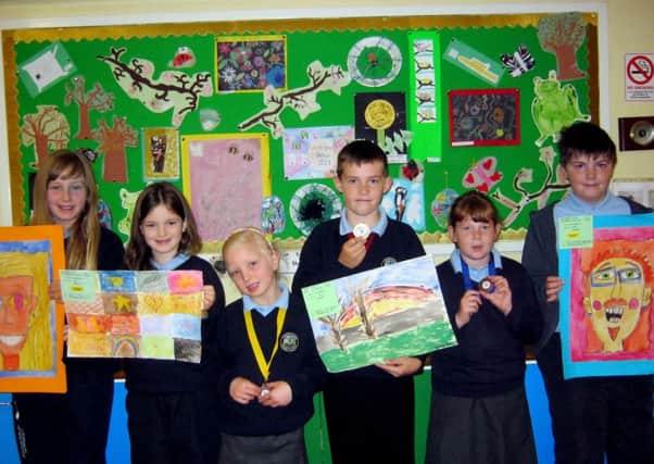 The children from Portglenone Primary School, who won prizes for their artwork at the Kilrea Flower Show and the Antrim Show 2013. From left to right: Amie McLeister, Julie Allen, Eva Vangrove, Bailey Kerr, Louise Flemming, David Atkinson.