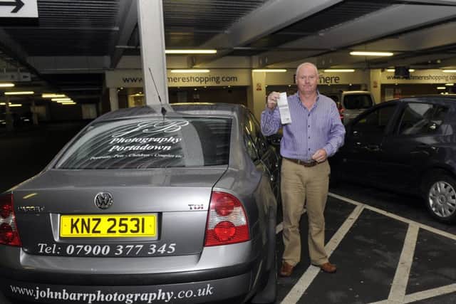 John Barr with the parking ticket he received at Rushmere. INPT37-123gc