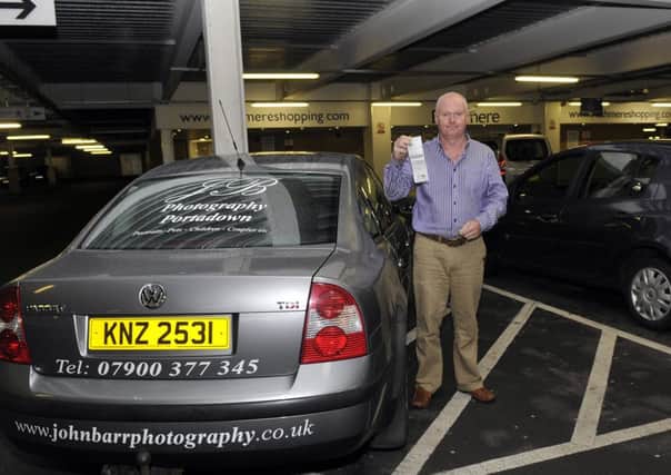 John Barr with the parking ticket he received at Rushmere. INPT37-123gc