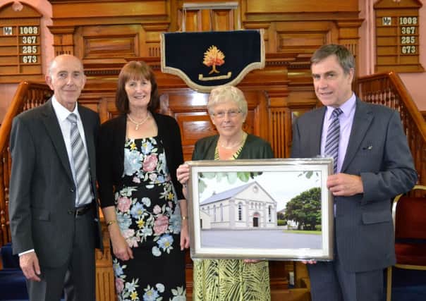 Mrs Lorna McNeely 2nd right and Walter Hoy (Clerk of Session)  right, presenting the Rev. David Hillen and Mrs Anne Hillen with a framed picture of Magheramason Presbyterian Church, one of many gifts which they received from the congregation, to marked the Rev Hillens retirement as  their  minister  after 21 years of faithful and dedicated service.