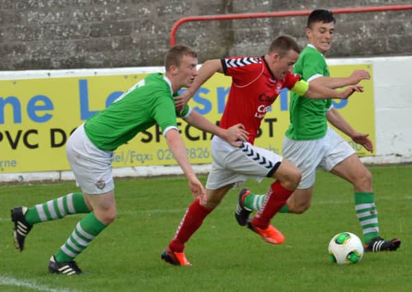 Larne FC captain Paul Maguire takes on the Cliftonville Olympic defence in their Steel and Sons Cup game at Inver Park. INLT 38-001-PSB