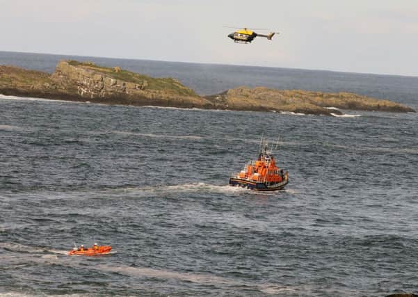 14 Sept 2013....HM Coastguard from Coleraine and Ballycastle, RNLI Lifeboats ILB and ALB from Portrush,Police Helicopter and a Specialist Irish Coastguard Helicopter Rescue 118 from Sligo have been searching for a number of Hours near Ramore Head Portrush where a fisherman fell into the water he is understood to be Polish and in his thirties.The searh is expected to continue until darkness and will be likely to resume again at first light tomorrow. As this search was onging a man fell from the Cliffs in Portstewart and has been winched from the Water by Rescue 118 from Sligo his condicition is unknown. PICTURE KEVIN MCAULEY PHOTOGRAPHY MULTIMEDIA