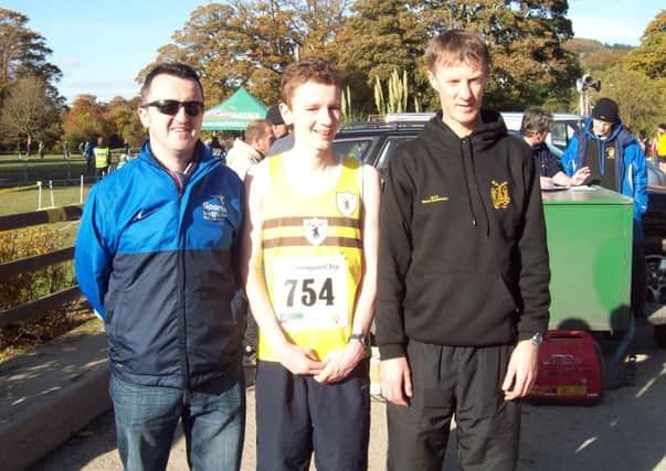 Chris McQuillan and Connor McQuillan with Fit N Running coach Gregory Walsh.