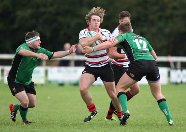 City of Derry duo Cathal Cregan and Adam Bratton move into to dispossess a Rainey player during Saturdays eight-try Ulster Senior Cup victory in Magherafelt.