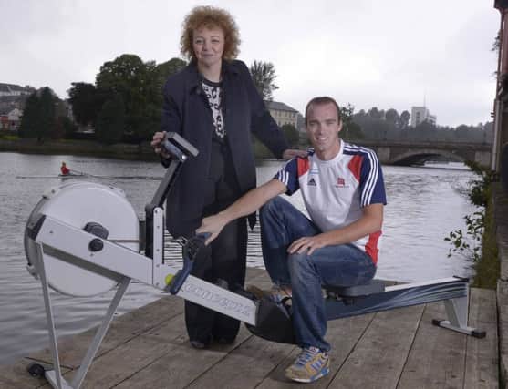 Sports Minister Carál Ní Chuilín pictured here with Olympic Silver medalist Peter Chambers testing out the new equipment during her visit to the Borough of Coleraine on Wednesday.