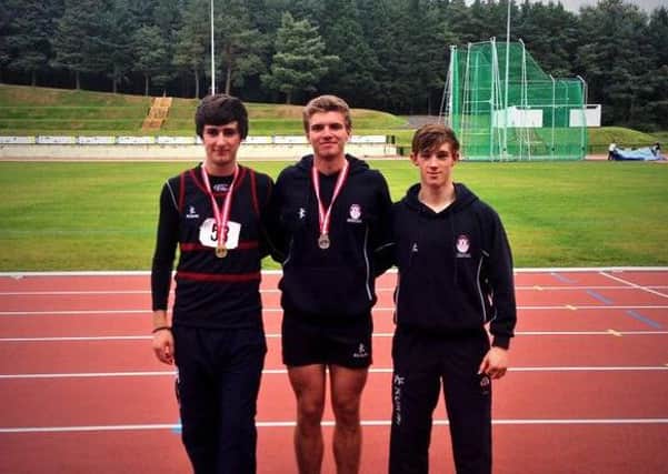Carrick Grammar pupils Christian Robinson, Jake Porter and Karl McLean at the Mary Peters Track in Belfast. INLT 39-904-CON