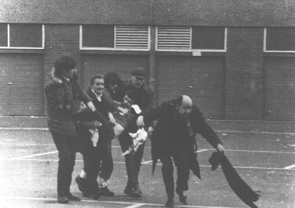One of the most iconic images of Bloody Sunday, Fr. Daly leading a group carrying a dying Jackie Duddy. (Fulvio Grimaldi), will feature in Haris Paaovic's 'The Conquest of Happiness.'
