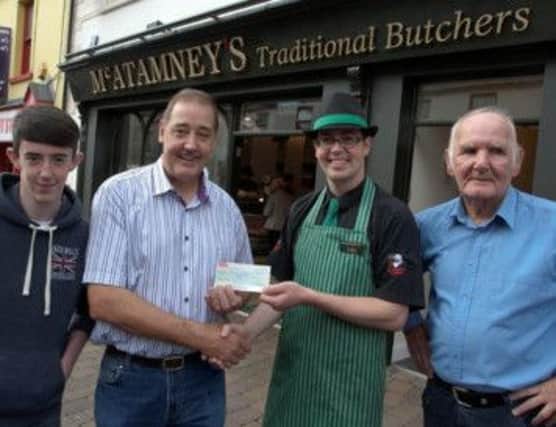 JOINT SPONSOR. Colin Apperley from sponsors McAtamney's Butchers, pictured presenting a cheque for £100 to Uel Wylie from Rafters Snooker Club. Looking on are Mattthew Wylie and Nevin Cup organiser Sammy Wa;ker.INBM35-13 007SC.