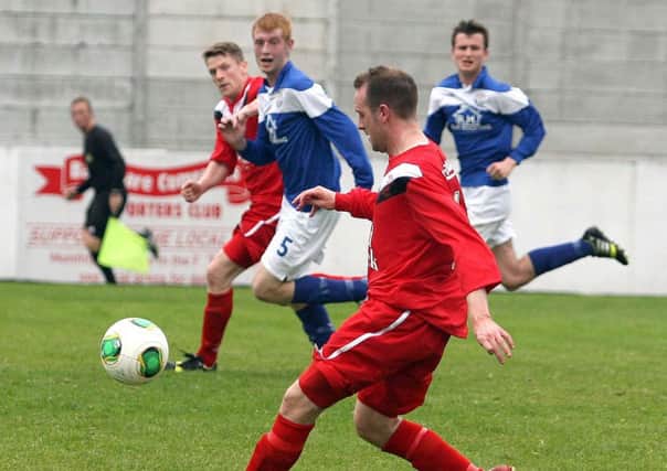 Ballyclare's Andy Simms on the attack in the last week's 3-2 win over Limavady United. INNT 39-051-FP