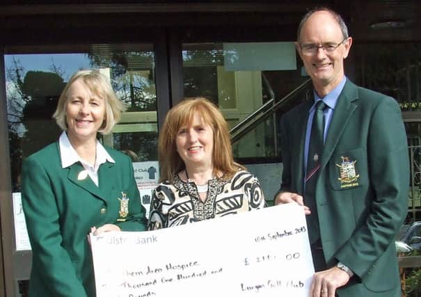 Lady Captain Anne Knox and Captain Sean Wilson hand over a cheque to Deirdre Breen from South Area Hospice. INLM39-207