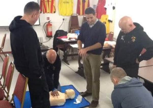 Updating their first aid skills. INLM39-213