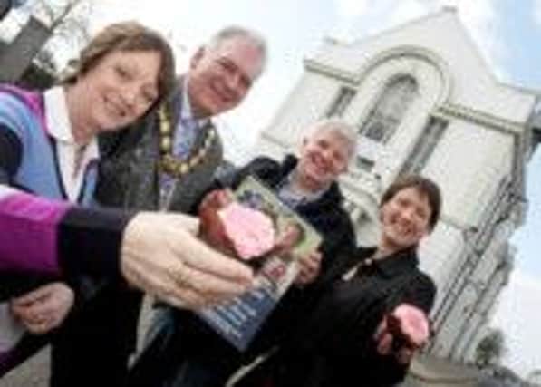Ballymoney Council's Elizabeth Johnston, former Mayor Ald Bill Kennedy with Sean McCarry and Margaret Elliott of Community Rescue Service pictured in 2011 before a screening of Cupcake in Ballymoney Town Hall. Now the film can be viewed on DVD. INBM40-13