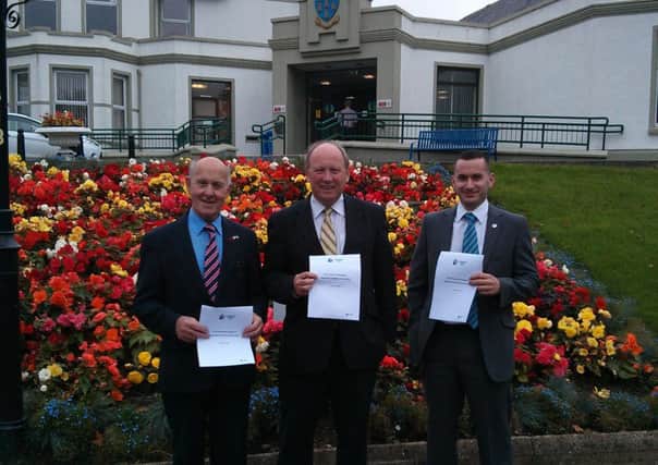Cllr Roy Gillespie; Jim Allister MLA; and Cllr Timothy Gaston of the TUV present a UDR Memorial consultation response to Council.