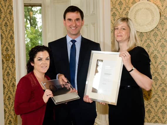 Department for Employment and Learning Permanent Secretary Derek Baker and Cate McCandless and Lauren Cater from Schlumberger Completions Products Centre Belfast.