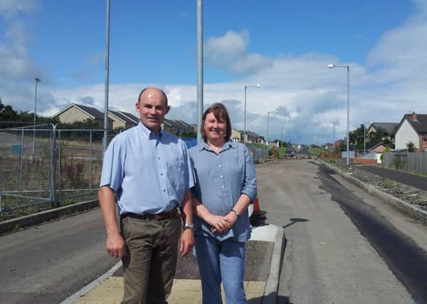 East Antrim UUP MLA Roy Beggs and Larne Mayor Maureen Morrow inspect the road works being carried out at Lindara in Larne.  INLT 40-675-CON