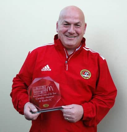 Carniny Amateur and Youth FC Chairman Anthony McCartney with the club's IFA accredited Club of the Year Award they received last weekend