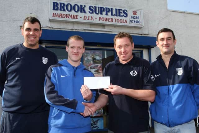 Stuart McDonald, Jason Stewart and Paul McBurney of Ahoghill Thistle, are pictured receiving sponsorship from Darren Logan of Brook Supplies. INBT40-239AC