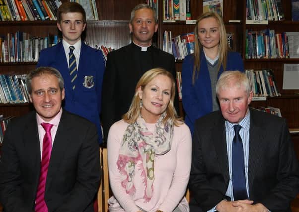 Former Garron Tower pupil Anne McReynolds who is Chief Executive of the MAC (Metropolitan Arts Centre), Belfast, was back at her old school last week as guest of honour at the St Killian's College prize night. She is seen here with school principal Mr Jonny Brady (front left) vice-chairman of the Board of Governors Sean Doherty (front right), fellow guest Fr Martin O'Hagan, Head Boy Ronan McAuley and Head Girl Hanna McIlwaine.  INLT 40-813-CON