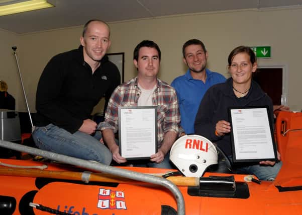 RNLI crew members, Barry Kirkpatrick, William Evans, Christopher Dorman and Pamela Dorman and not pictured, Dave Somerville with letters of appreciation   RNLI