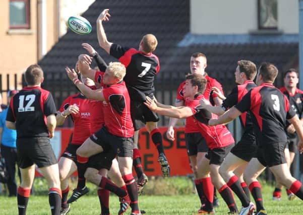 Up in the air: Action from Carrick v Limavady. INLT 40-419-RM