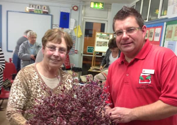 Gary Bisset of Inver Garden Centre Larne with a member of Crumlin Flower Club.