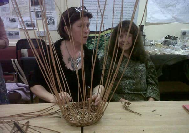 Willowcraft tutor Teresa O'Hare, demonstrating basket weaving at RAPID offices on Foreglen Road.