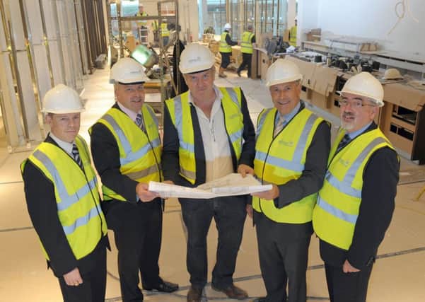Pictured at the new Next Superstore in Lisburn, Sprucefield, which is the largest store in Northern Ireland and which will open later in October are (l-r) Paul McAteer, Assistant Director, Building Control Services, Lisburn City Council; Councillor Uel Mackin, Chairman of Lisburn City Councils Planning Committee; Mr Robin Crane, Next; Alderman James Tinsley, Vice-Chair of the Planning Committee, Lisburn City Council and Colin McClintock, Director of Environmental Services.