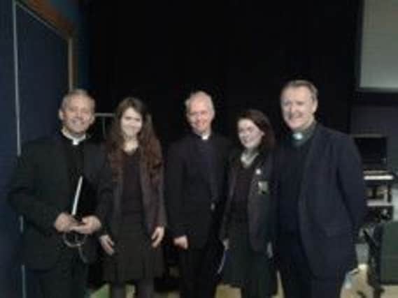 Bronagh McCaughan and Annie Laverty from Cross and Passion College with the Priests, Fr Eugene O'Hagan, Fr, Martin O'Hagan and Fr. David Delargy. INBM41-13