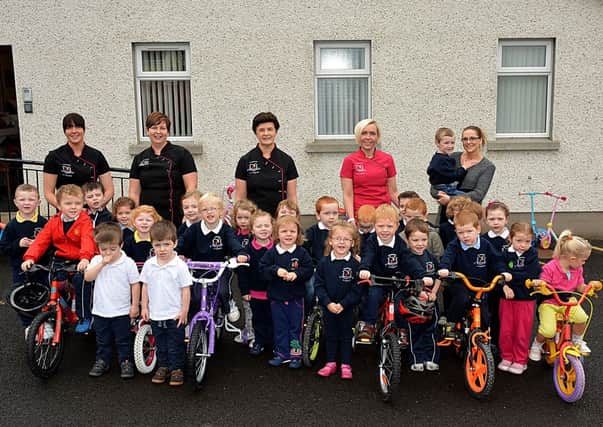 Children from Taylorstown Community Play Group pictured at the start of their annual cycle ride, raising money for the group. INBT40-221AC