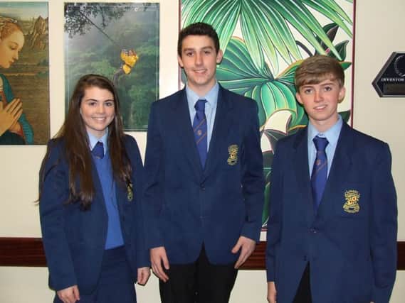 Loreto College students who took the top three places in Northern Ireland in CCEA GCSE Economics: Brega Mullan  third place, Joseph McNerlin  second place and Ronan McCarry from Ballycastle  (first place).