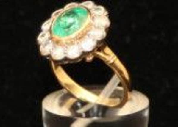 A very fine 18ct Gold Emerald and Diamond Cluster Ring realised £160