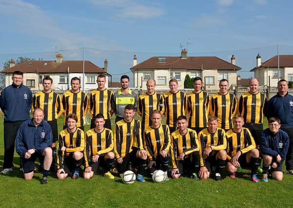 FC Penarol pictured in their new Strip sponsored by the Candy Bar. Included are team officials Stephen McKelvey, Leo Carlisle, Adie McCann and Donald McKelvey. INBT40-240AC