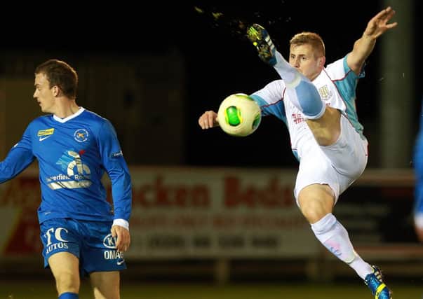 Ballymena's David Cushley tries a spectacular volley during Friday night's defeat at Ballinamallard. Picture: Press Eye.
