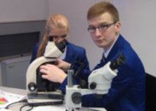 Year 14 students Aine McDonnell and Conal Quinn using the STEM module equipment. INLT 41-655-CON