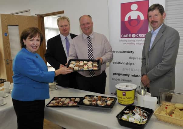 Upper Bann MP, David Simpson serves the treats at the Coffee Morning he hosted in the Jethro Centre to raise  awareness and funds for Care in Crisis. Included are Diane Dodds, MEP, Robin Pillar, Care in Crisis and John Beggs, chair of the trustees. INLM41-107gc