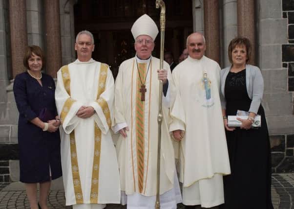 Bishop John McAreavey with newly ordained deacons and their wives.
from left; Moya Devine,  Kevin Devine,Bishop McAreavey,Gerry Heaney and Phyllis Heaney  
Ordination of Permanent Deacons for Dromore Diocese
Saint Peter's  Lurgan Co.Armagh
6 October 2013
CREDIT: LiamMcArdle.com