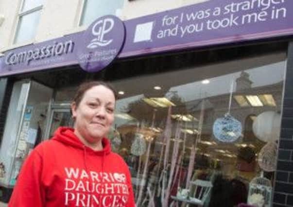 THROUGH IT. Annie Ratcliffe, pictured outside Compassion charity shop in Ballymoney.INBM41-13 020SC.