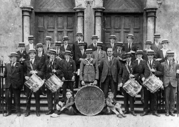 A real blast from the past - The Ballymena Excelsior Flute Band: (back row from left) A. Carleton, R. Reid, B. Hamill, A. Ross, A. Pedlow, J. McClintock, J. Wilson and H. O'Neill; (middle row) J. Reid, J. Scullion, W. Kilpattrick, A. Grant, A. Eagleson, T. Eagleson, T. Murray, and R. Ballentine; (front row), R. Eagleson, J. O'Neill, J. Kennedy, D. McClintock, J. Barr, J.H. Montgomery, H. Bell, J. Houston, S. Wilson, W. Montgomery; (boys) J. Leitch and A. Thompson.