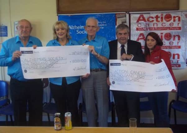 Brendan, Clare and Brian from the Alzheimer's Society, Ritchie Gorman, Captain, Lambeg Golf Club and Emma McArdle from Action Cancer after receiving cheques for £1200 each, which was raised at the Captain's Charity Day.
