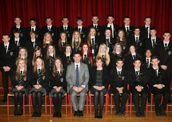 Students from Dunclug College who received Honours Awards are pictured with Principal Mrs. R. Wilson and Vice-principal Mr. N. Oliver. INBT40-251AC