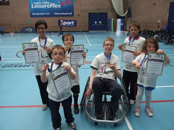 These young children receive their awards during the Paralympic Fun Day.