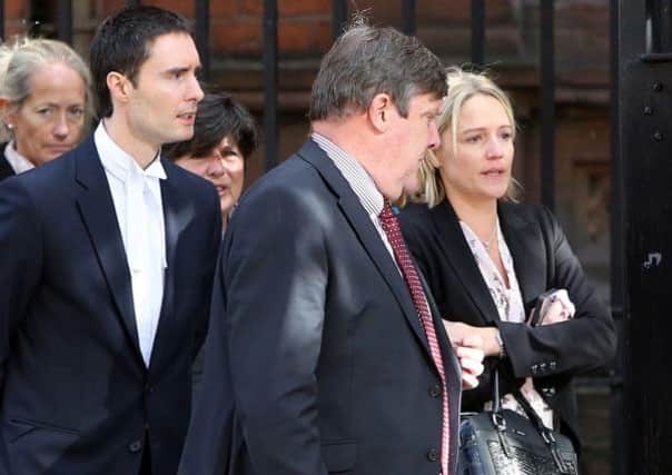 Samatha Bennett (right), the mother of 20-month-old Liam Gonzales Bennett, leaves court with family and legal representatives after an inquest into his death at the Coroners' court, Belfast. PRESS ASSOCIATION Photo. Picture date: Thursday October 10, 2013. See PA story ULSTER Toddler. Photo credit should read: Paul Faith/PA Wire