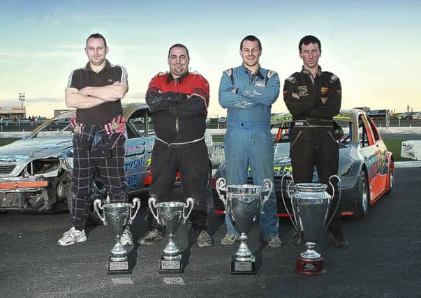 Northen Ireland's four World Champions at the Tullyroan Oval recently. The drivers, Nigel Jackson, Ryan Abernethy, Shane Murray and John Christie from Crumlin, turned out with their title winning cars and trophies in a meet and greet for fans.