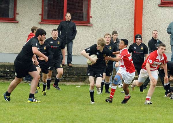 Ballymena U-17's snatch the ball and run during their match on Saturday morning against Randalstown U-17's. INBT 42-863H